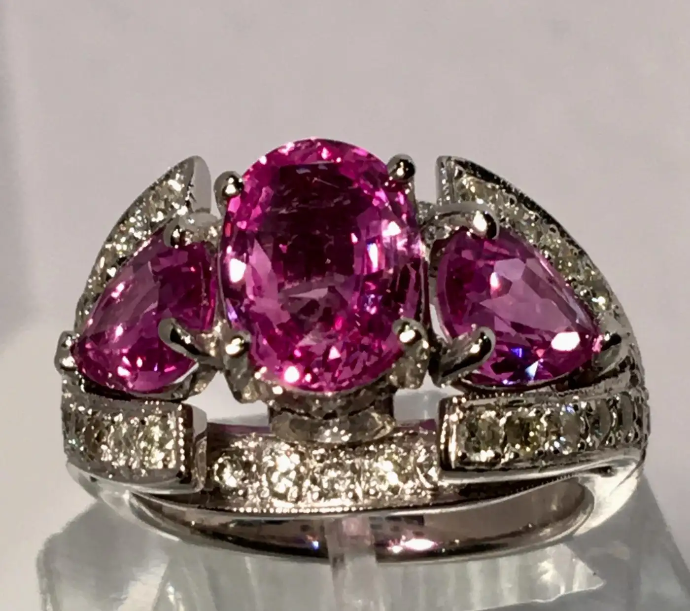 Spectacular Vivid Pink Sapphire Diamond Platinum Three-Stone Ring Spectacular Vivid Pink Sapphire Diamond Platinum Three-Stone Ring